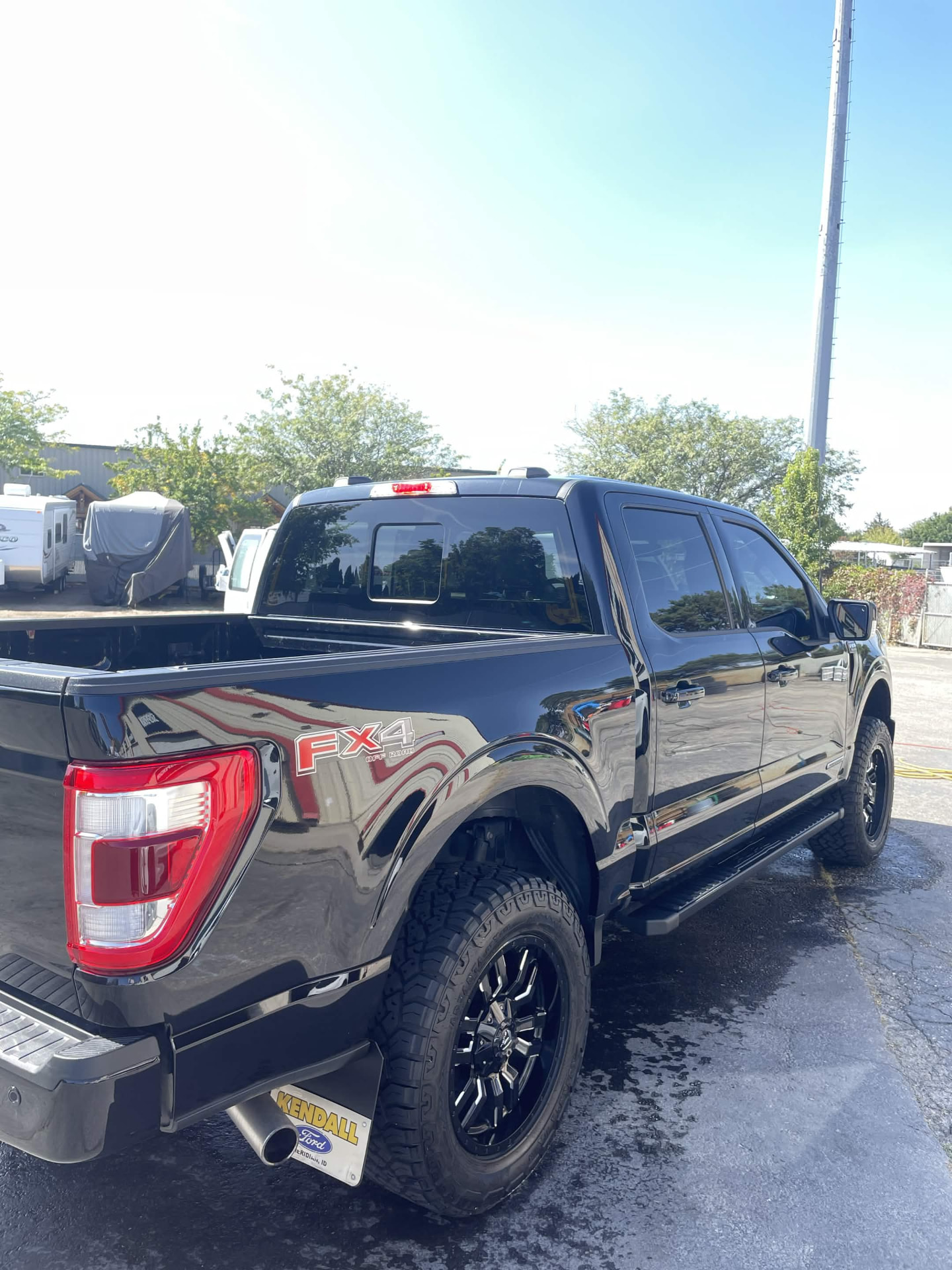 Gloss black Ford F-150 FX4 off-road pickup after detailing